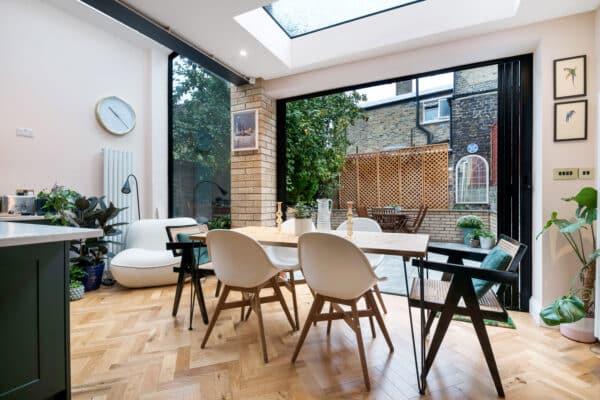 Simply Extend | Open-plan kitchen with kitchen table and bifold doors | London
